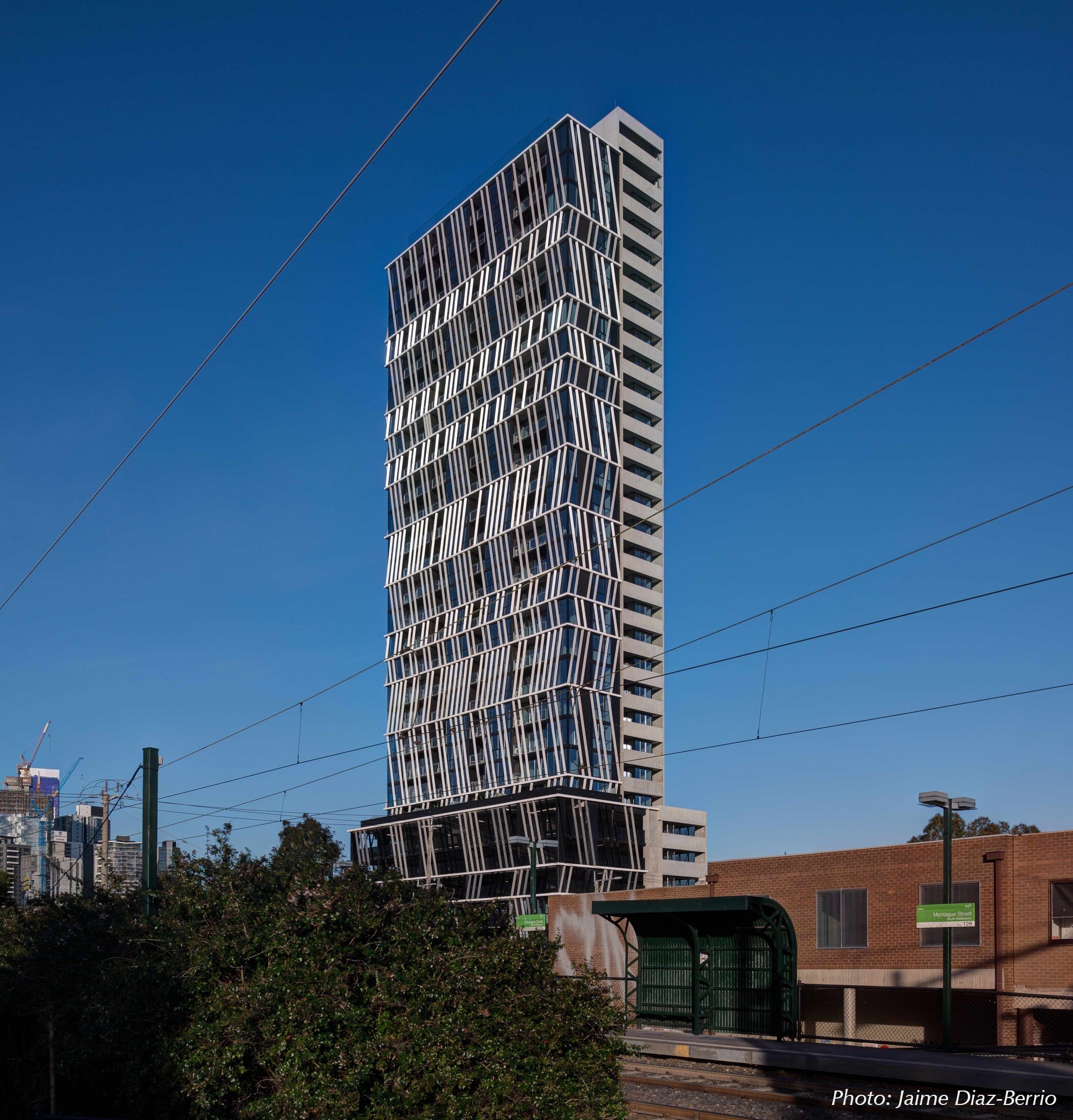 Gravity Tower by Plus Architecture against a clear blue sky.