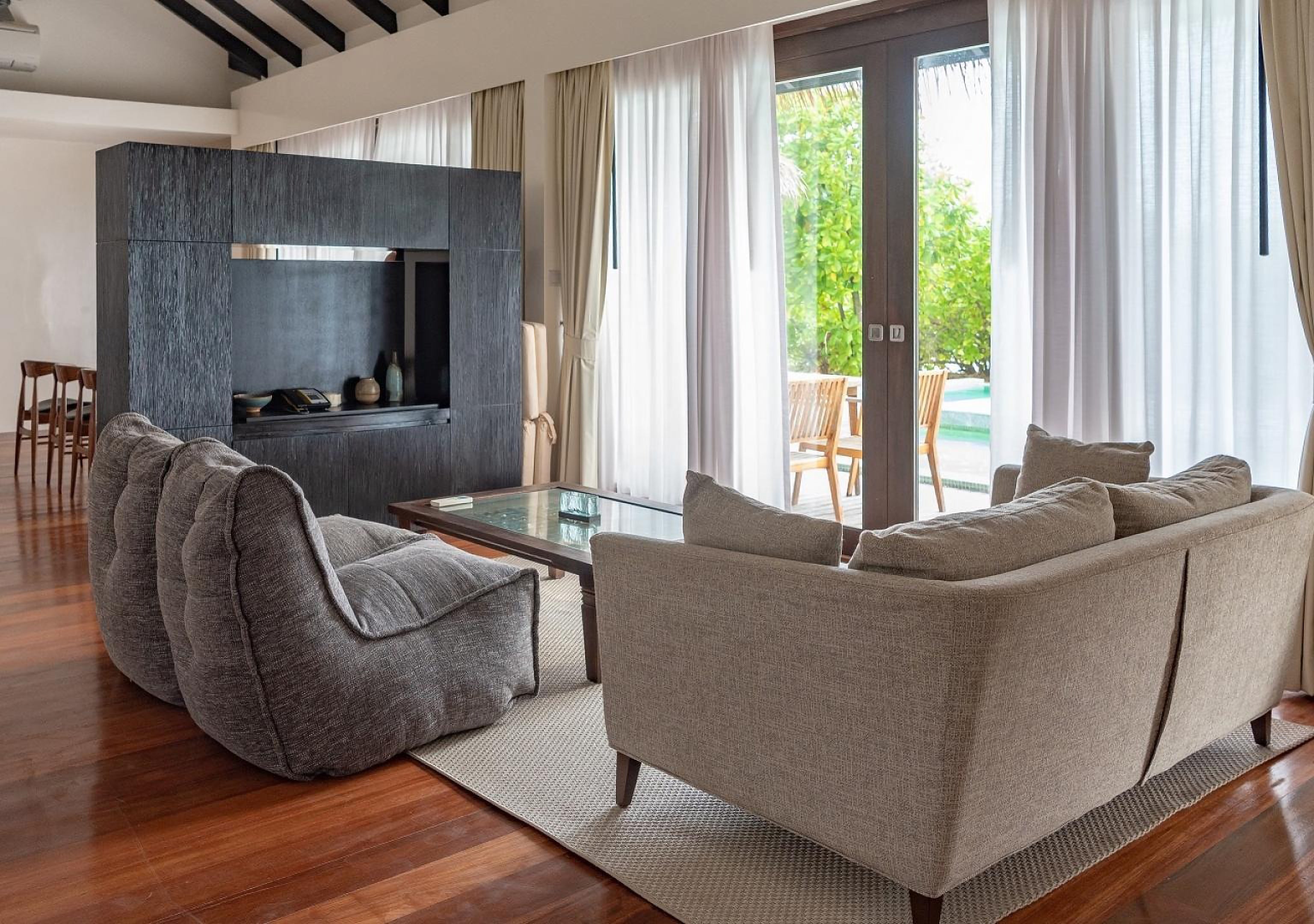 Side view of Twin Couch bean bag in Luscious Grey in living room of 2-Bedroom Beachfront Pool Villa.
